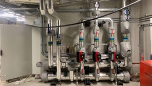 industrial heating system insulated with foiled fiberglass and valves fitted with removable valve covers done by Lagforce