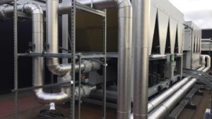 AC roof chiller pipework insulated and weather protected with aluminium cladding by Lagforce.