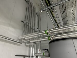 Boiler house water services pipework insulated with foiled fiberglass by Lagforce in Naas in Kildare